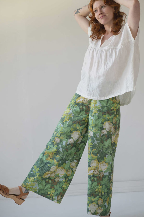 Lazybones Ollie Pant Sidewall  A variation on our popular Ollie pant. Now in organic cotton Sidewall floral green print.  There's a reason our Ollie pants are one of our best sellers... They are ridiculously comfortable and stylish to wear :)  Wide leg pants with a flat front and front pockets. Elastic waist at back only.  This print is Sidewall.  100% fair trade organic cotton voile Heavier weight voile
